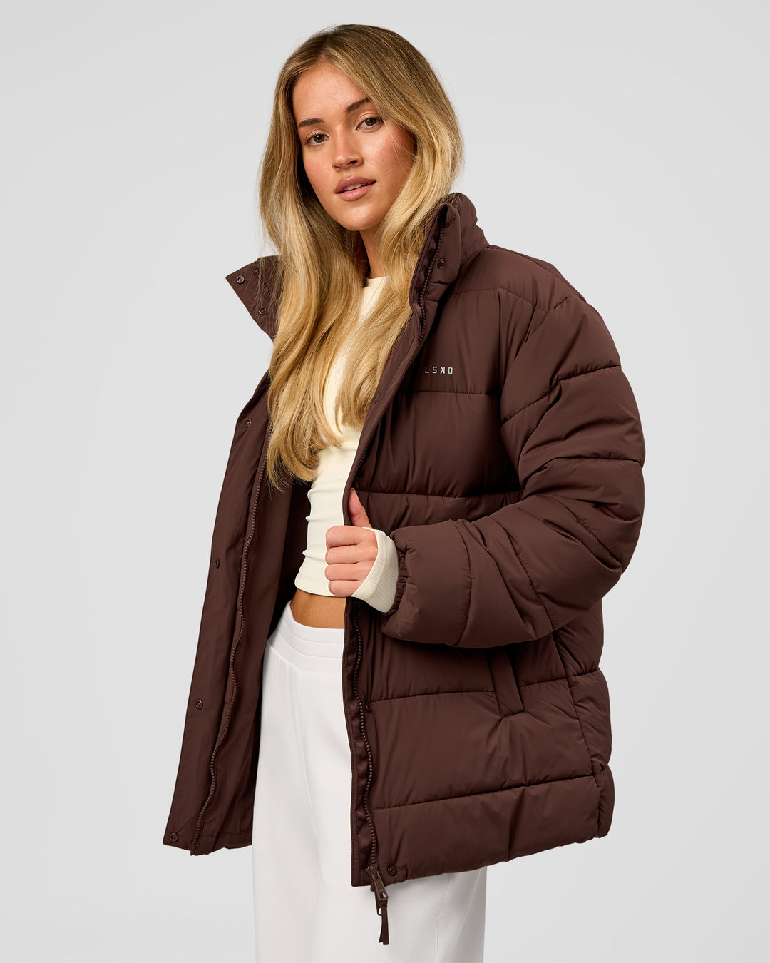 Woman wearing Go-To Puffer Mid Jacket - Hot Chocolate | Model:Issy | Size:XS - view 1