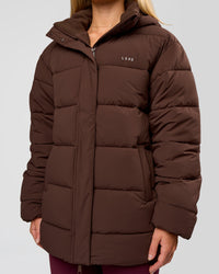 Woman wearing Go-To Puffer Mid Jacket - Hot Chocolate | Model:Issy | Size:XS | Thumbnail Index: 1