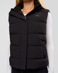 Woman wearing Go-To Puffer Vest - Black | Model:Issy | Size:XS | Thumbnail Index: 2