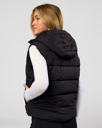 Woman wearing Go-To Puffer Vest - Black | Model:Issy | Size:XS | Thumbnail Index: 1