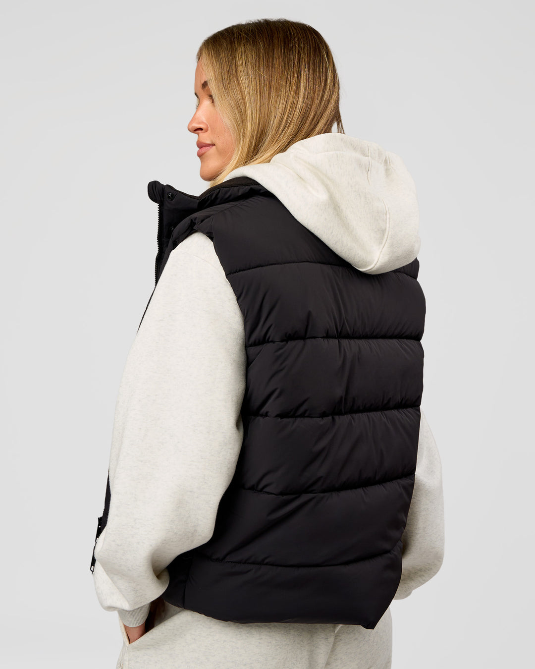 Woman wearing Go-To Puffer Vest - Black | Model:Issy | Size:XS - view 5