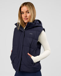 Woman wearing Go-To Puffer Vest - Future Navy | Model:Issy | Size:XS | Thumbnail Index: 0