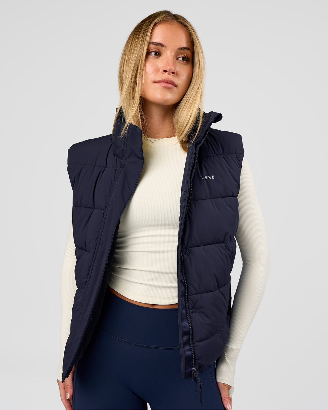 Woman wearing Go-To Puffer Vest - Future Navy | Model:Issy | Size:XS - view 2