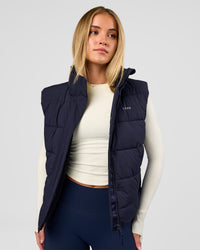 Woman wearing Go-To Puffer Vest - Future Navy | Model:Issy | Size:XS | Thumbnail Index: 1