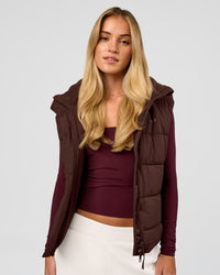 Woman wearing Go-To Puffer Vest - Hot Chocolate | Model:Issy | Size:XS | Thumbnail Index: 2