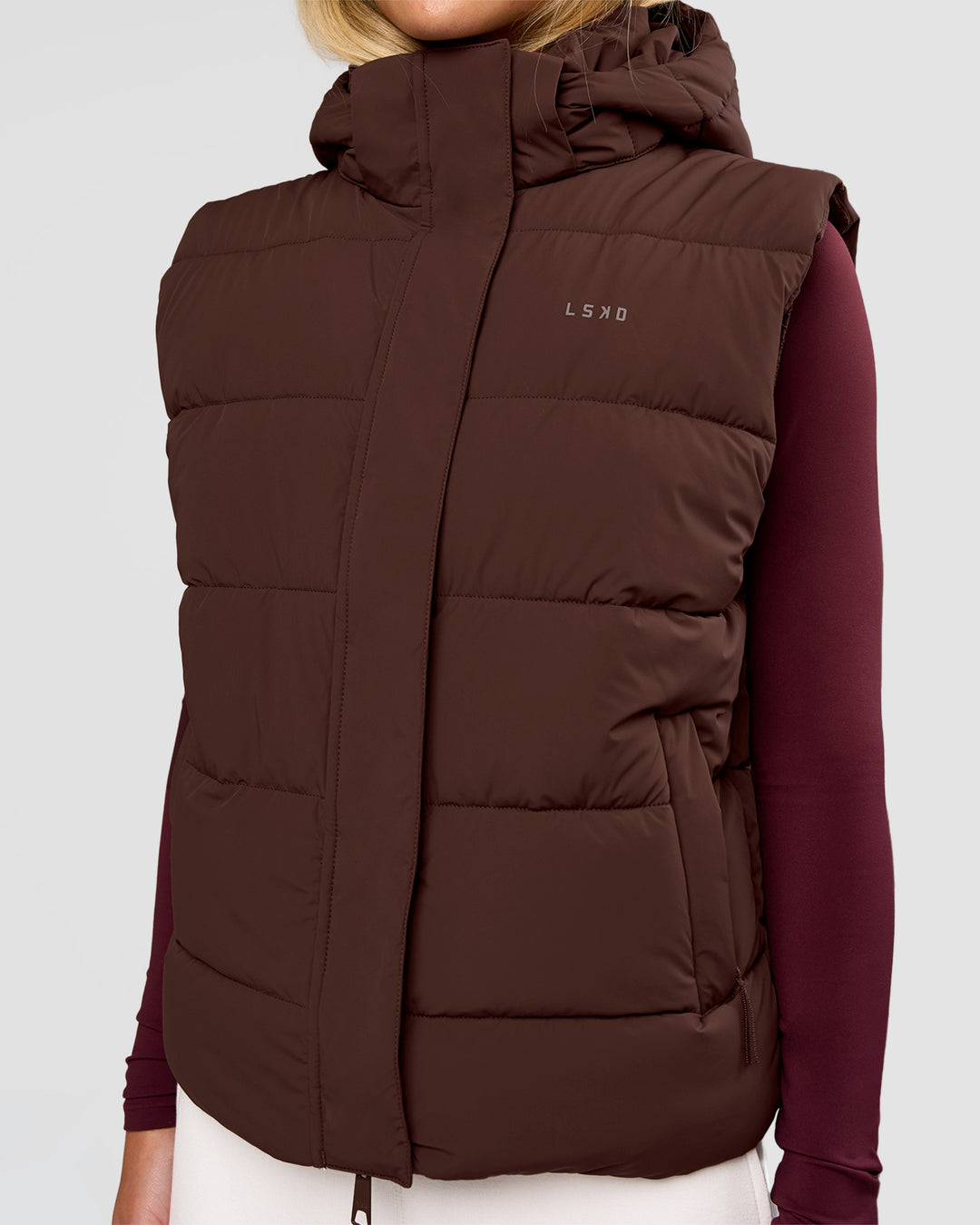 Woman wearing Go-To Puffer Vest - Hot Chocolate | Model:Issy | Size:XS - view 1