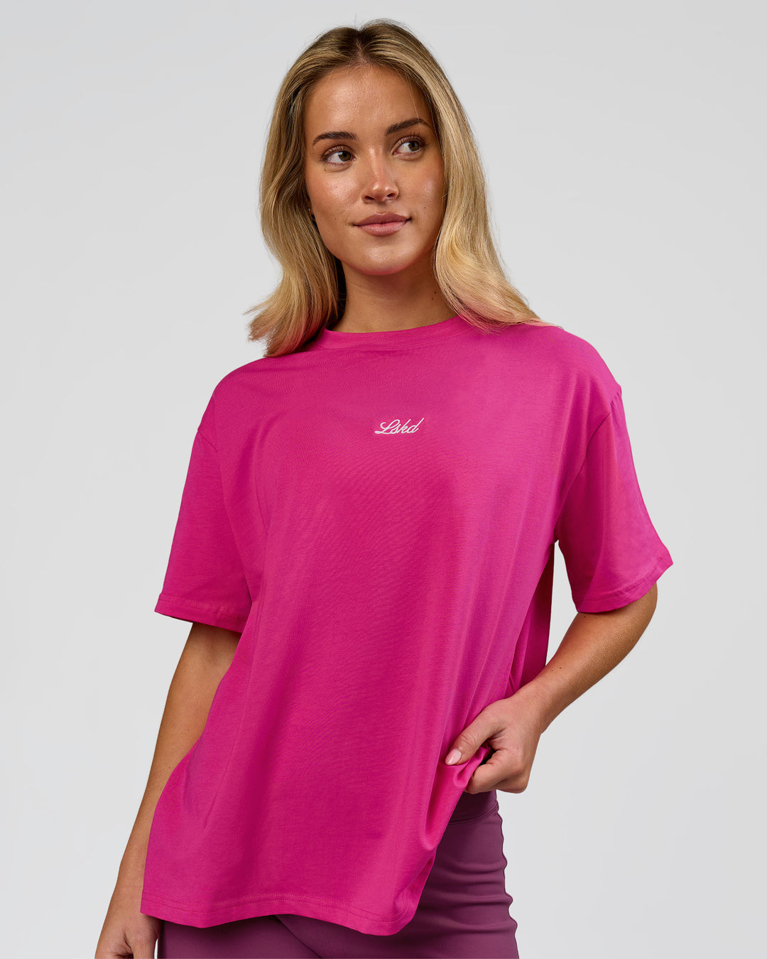 Woman wearing Go-To Script FLXCotton Oversized Tee - Ultra Pink-White | Model:Issy | Size:XS - view 1