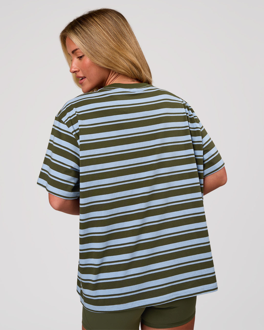 Woman wearing Go-To Shadow Stripe FLXCotton Oversized Tee - Pure Olive-Open Air | Model:Issy | Size:XS - view 4