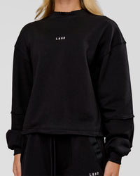 Woman wearing Go-To Terry Oversized Pull Over - Black-White | Model:Issy | Size:XS | Thumbnail Index: 1