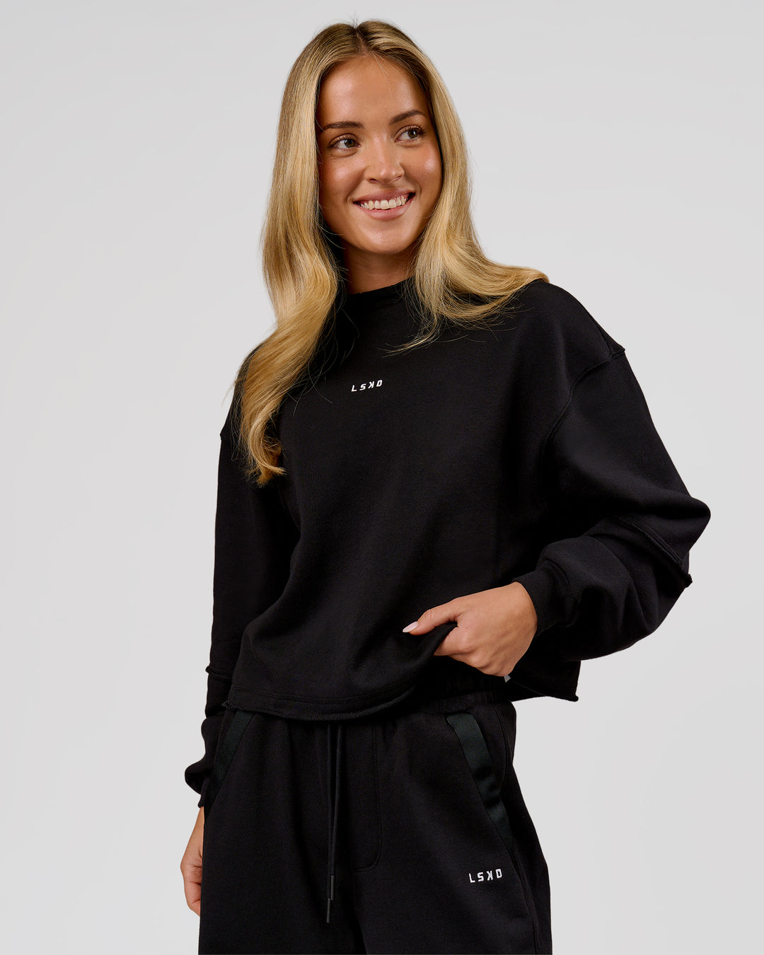Woman wearing Go-To Terry Oversized Pull Over - Black-White | Model:Issy | Size:XS - view 3