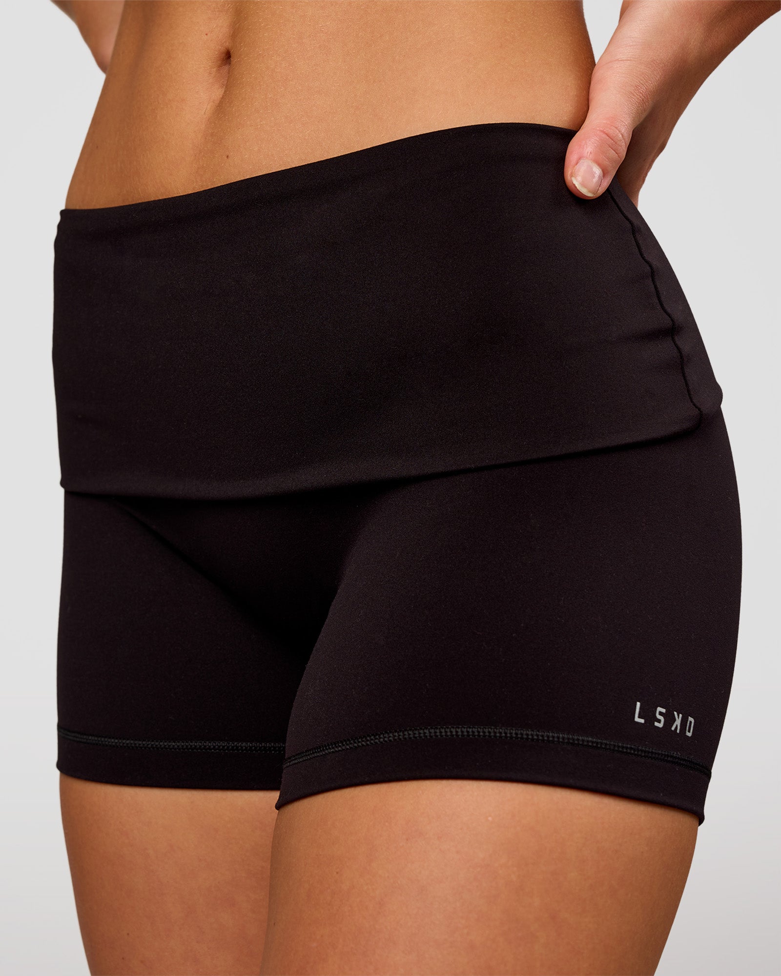 Woman wearing Groovy High Rise Fold Over 4" Short - Black | Model:Issy | Size:XS