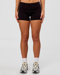 Woman wearing Groovy High Rise Fold Over 4" Short - Black | Model:Issy | Size:XS | Thumbnail Index: 2
