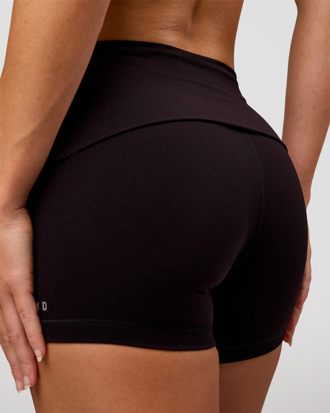 Woman wearing Groovy High Rise Fold Over 4" Short - Black | Model:Issy | Size:XS - view 6