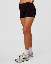 Woman wearing Groovy High Rise Fold Over 4" Short - Black | Model:Issy | Size:XS | Thumbnail Index: 6