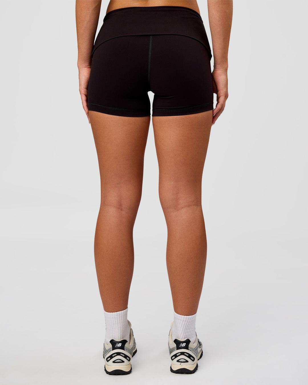 Woman wearing Groovy High Rise Fold Over 4" Short - Black | Model:Issy | Size:XS - view 8