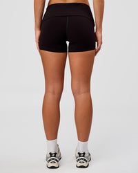 Woman wearing Groovy High Rise Fold Over 4" Short - Black | Model:Issy | Size:XS | Thumbnail Index: 7