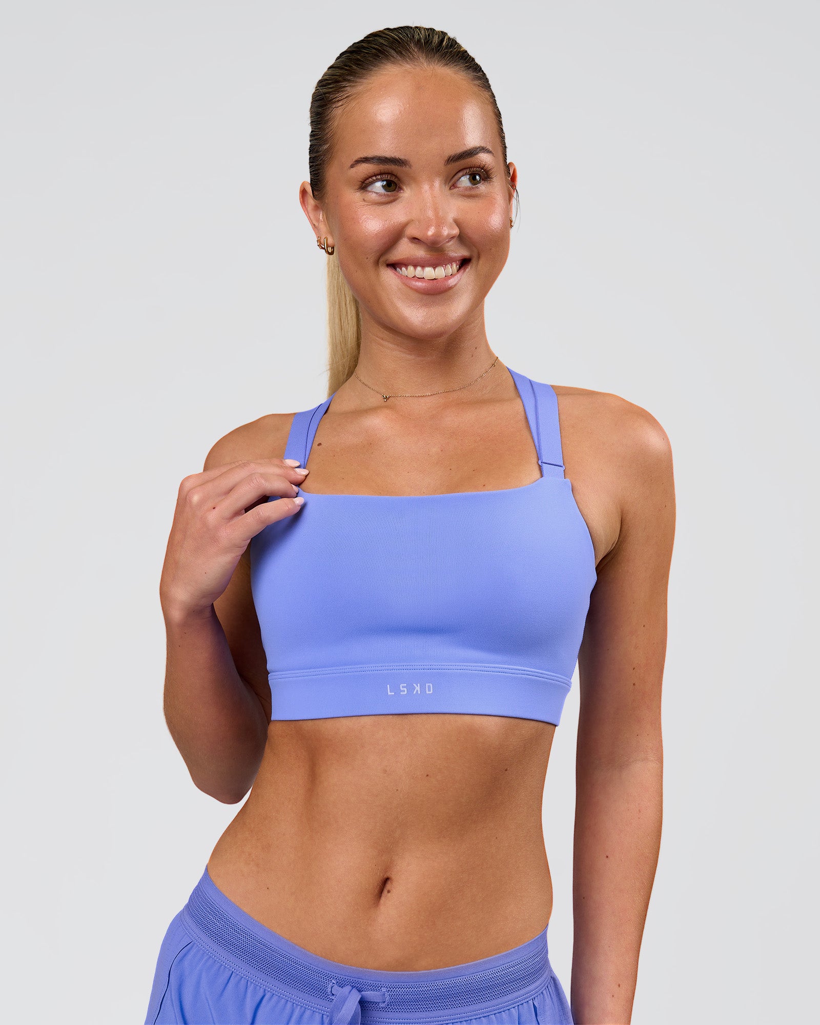 Woman wearing High Velocity Sports Bra - Bluebell | Model:Issy | Size:XS