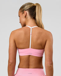 Woman wearing Infinity Sports Bra - Pink Rose | Model:Issy | Size:XS | Thumbnail Index: 1