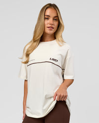 Woman wearing Inline Heavyweight FLXCotton Oversized Tee - Off White-Hot Chocolate | Model:Issy | Size:XS | Thumbnail Index: 8