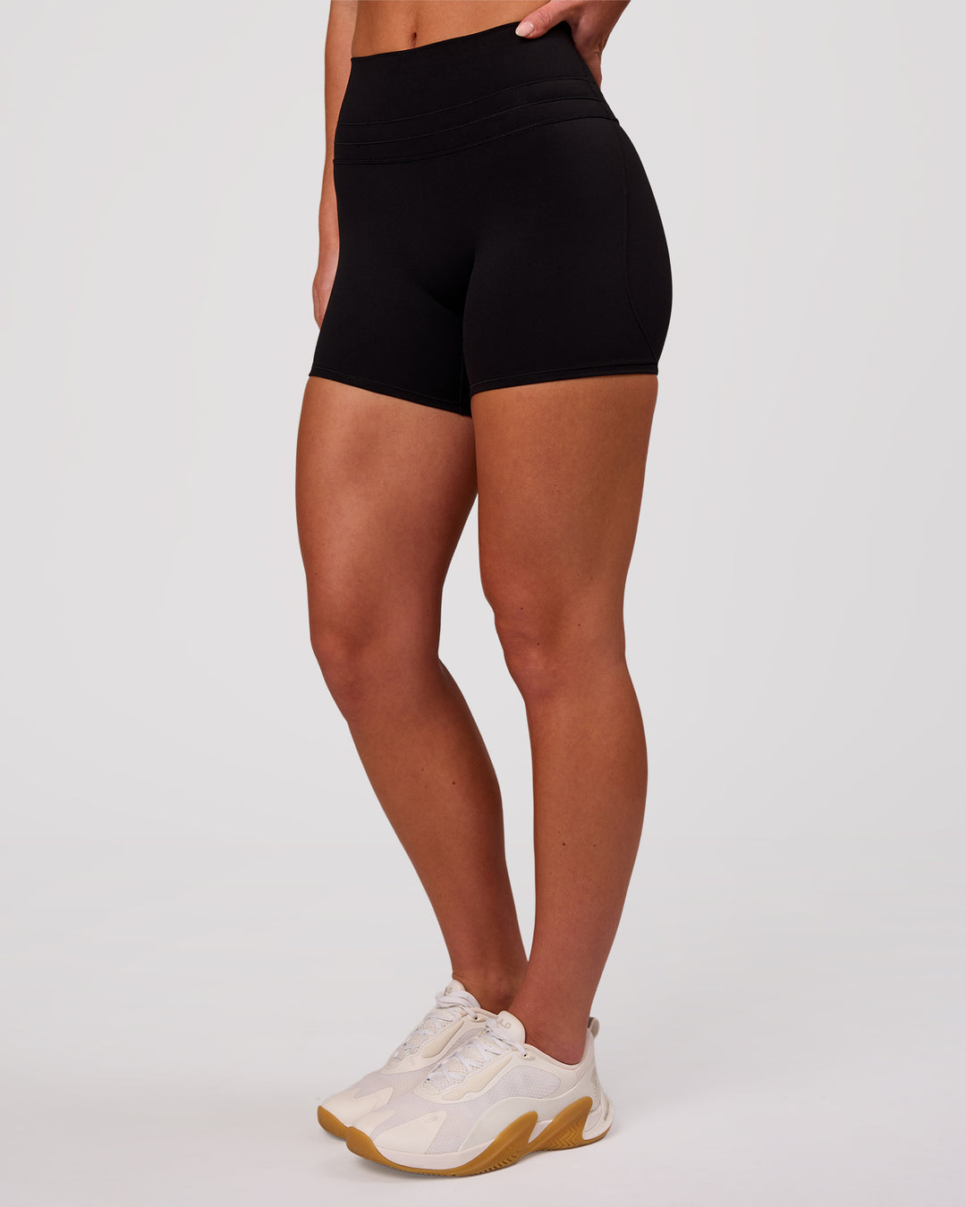Woman wearing Luxe V-Contour High-Rise 4" Short - Black | Model:Issy | Size:XS - view 6