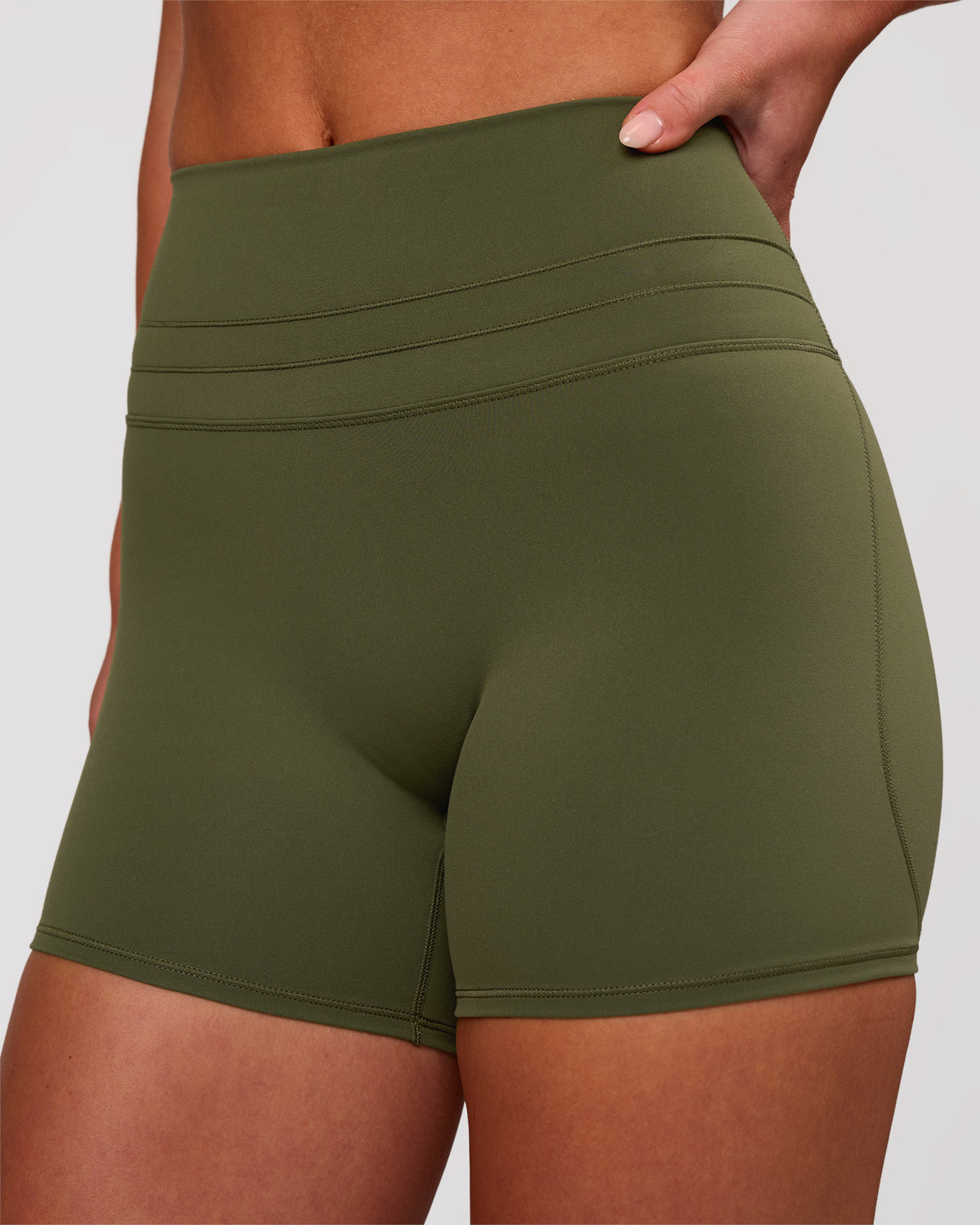 Woman wearing Luxe V-Contour High-Rise 4" Short - Pure Olive | Model:Issy | Size:XS - view 2
