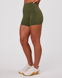 Woman wearing Luxe V-Contour High-Rise 4" Short - Pure Olive | Model:Issy | Size:XS | Thumbnail Index: 5