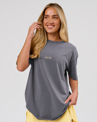 Woman wearing Magma FLXCotton Oversize Tee  - Dark Storm Washed-Lemon | Model:Issy | Size:XS | Thumbnail Index: 14