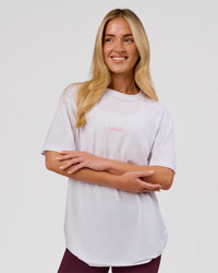 Woman wearing Magma FLXCotton Oversize Tee  - White-Pink Rose | Model:Issy | Size:XS | Thumbnail Index: 5