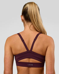 Woman wearing Momentum Sports Bra - Cherry Lacquer | Model:Issy | Size:XS | Thumbnail Index: 1