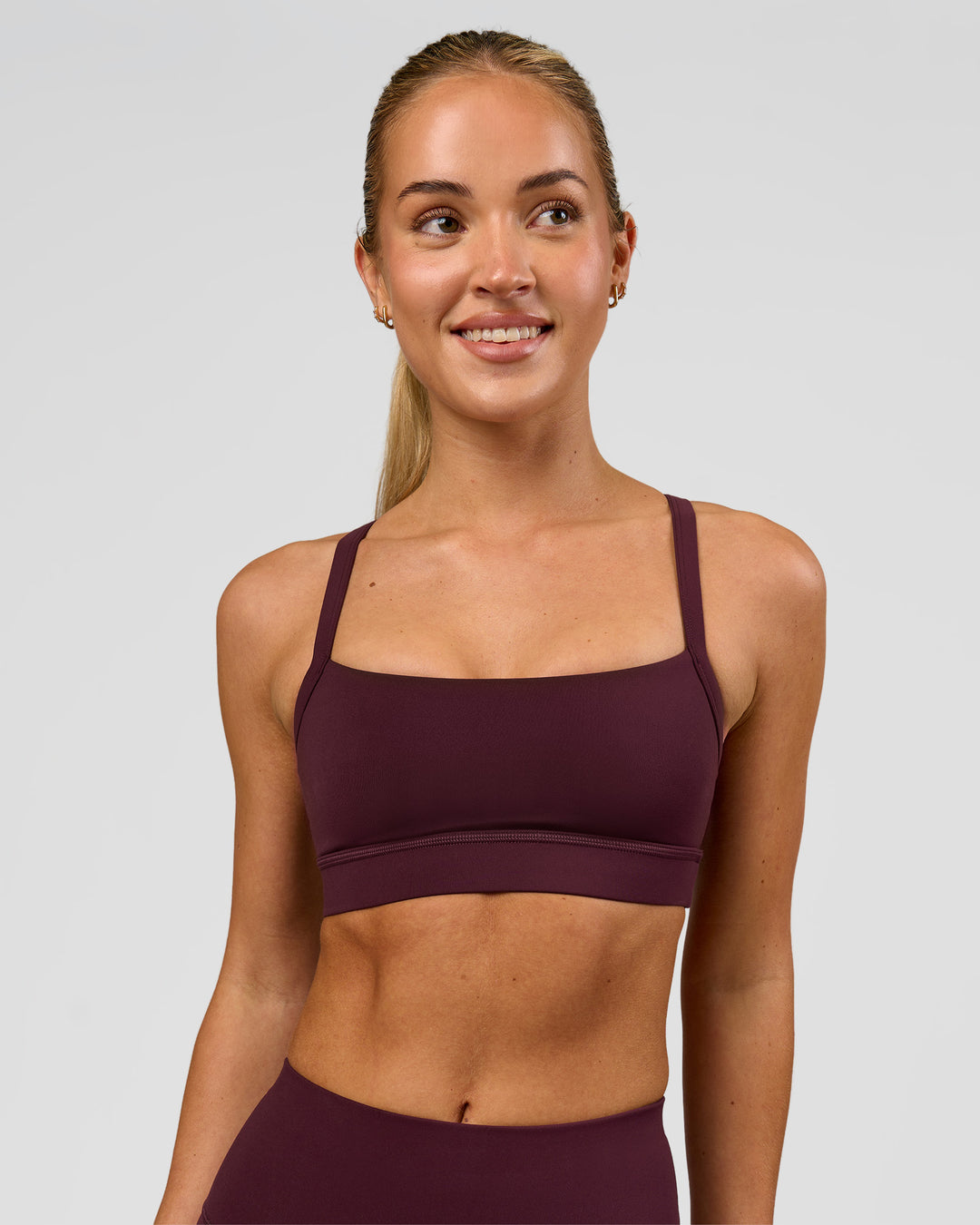 Woman wearing Momentum Sports Bra - Cherry Lacquer | Model:Issy | Size:XS - view 3