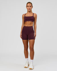 Woman wearing Momentum Sports Bra - Cherry Lacquer | Model:Issy | Size:XS | Thumbnail Index: 3