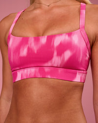 Woman wearing Momentum Sports Bra - Radiant Pink | Model:Issy | Size:XS | Thumbnail Index: 2
