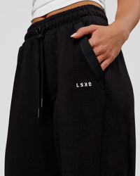 Woman wearing MVP Elite Terry Wide Leg Pant - Black-White | Model:Issy | Size:XS | Thumbnail Index: 8