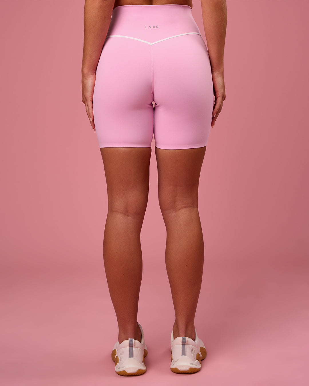 Woman wearing Pinnacle High-Rise 6" Short - Pink Rose-White | Model:Issy | Size:XS - view 5