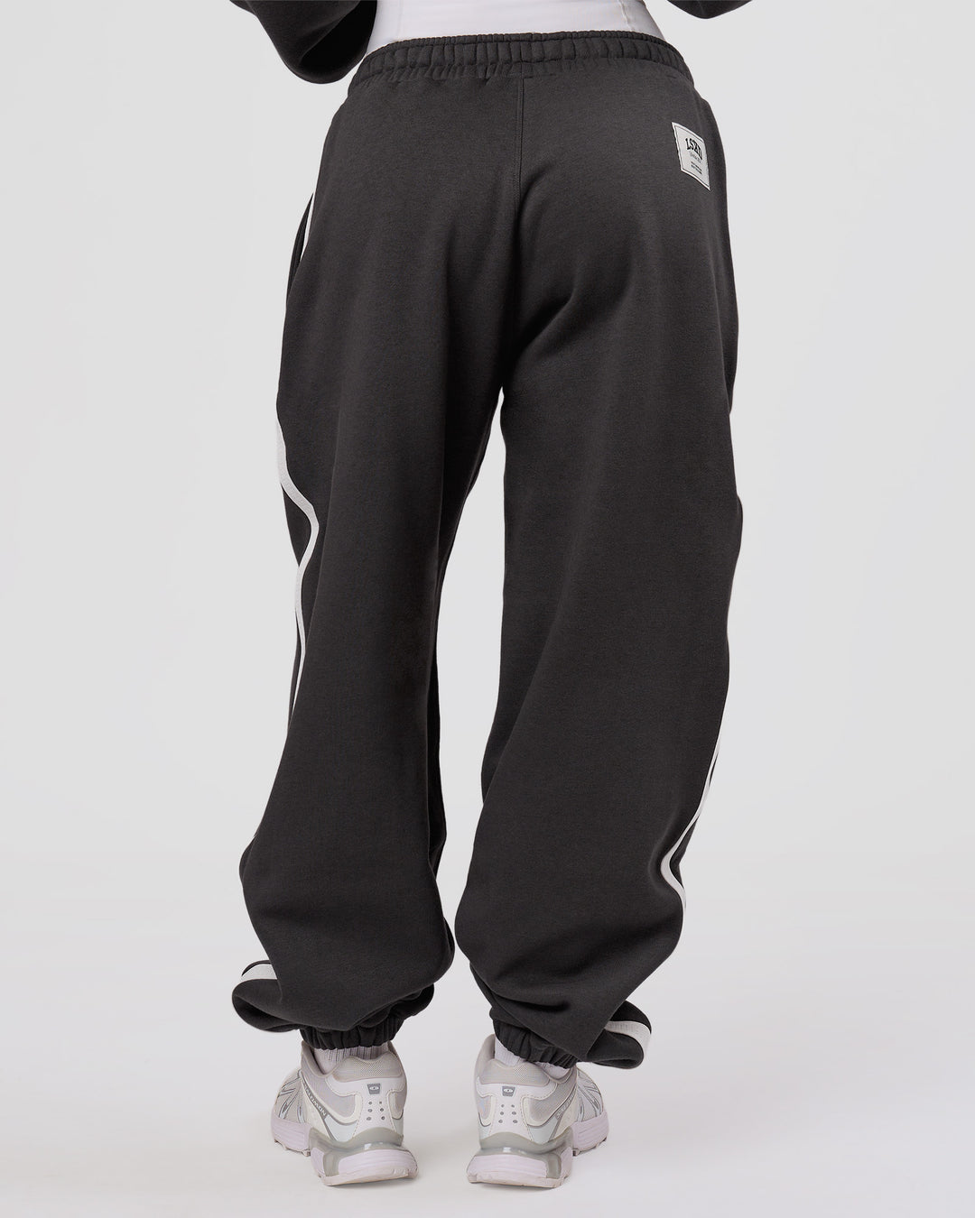 Woman wearing Playbook Baggy Cuffed Track Pant - Onyx-Off White | Model:Issy | Size:XS - view 6
