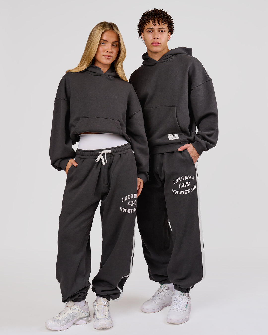 Woman wearing Playbook Baggy Cuffed Track Pant - Onyx-Off White | Model:Issy | Size:XS - view 10