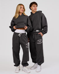 Woman wearing Playbook Baggy Cuffed Track Pant - Onyx-Off White | Model:Issy | Size:XS | Thumbnail Index: 11