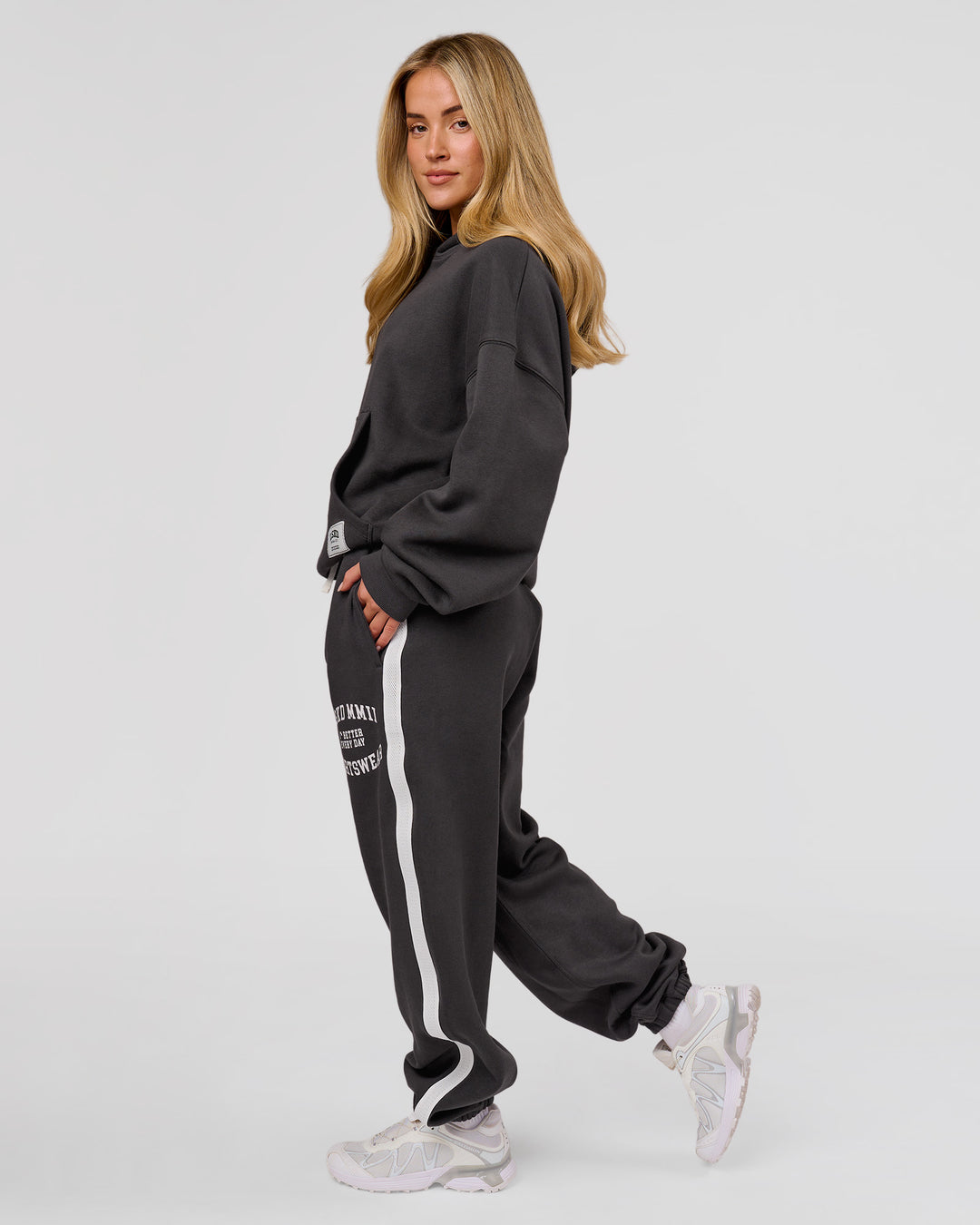 Woman wearing Playbook Baggy Cuffed Track Pant - Onyx-Off White | Model:Issy | Size:XS - view 15