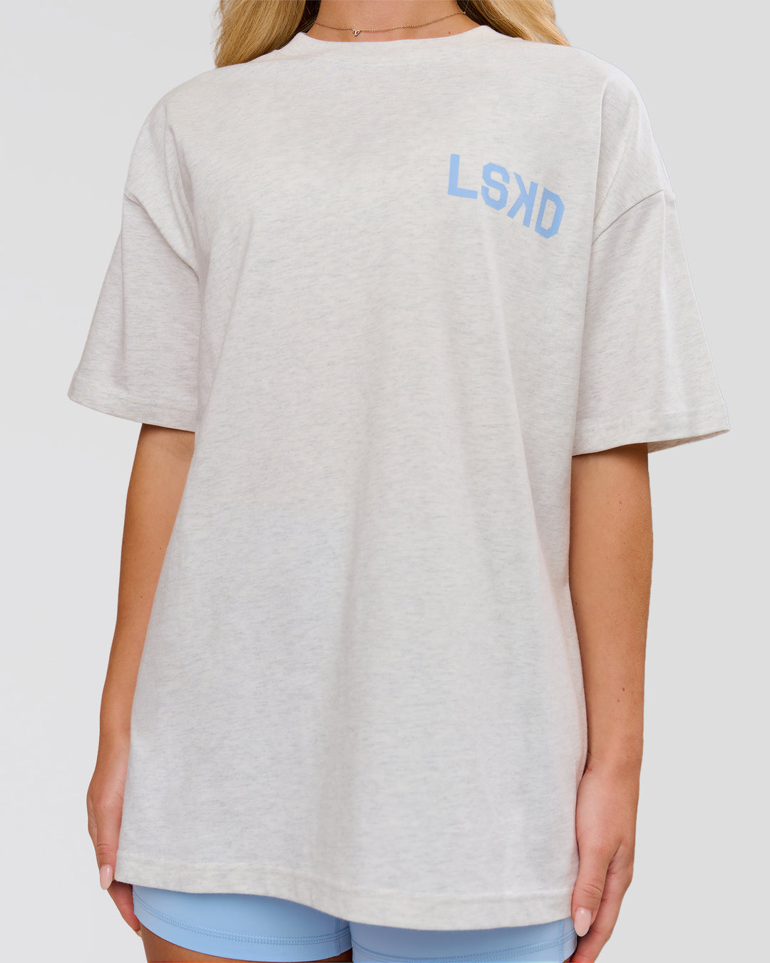 Woman wearing Playbook Heavyweight Oversized Tee - Silver Marl-Open Air | Model:Issy | Size:XS - view 9