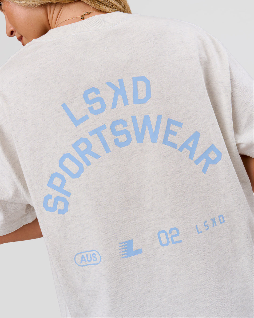 Woman wearing Playbook Heavyweight Oversized Tee - Silver Marl-Open Air | Model:Issy | Size:XS - view 1