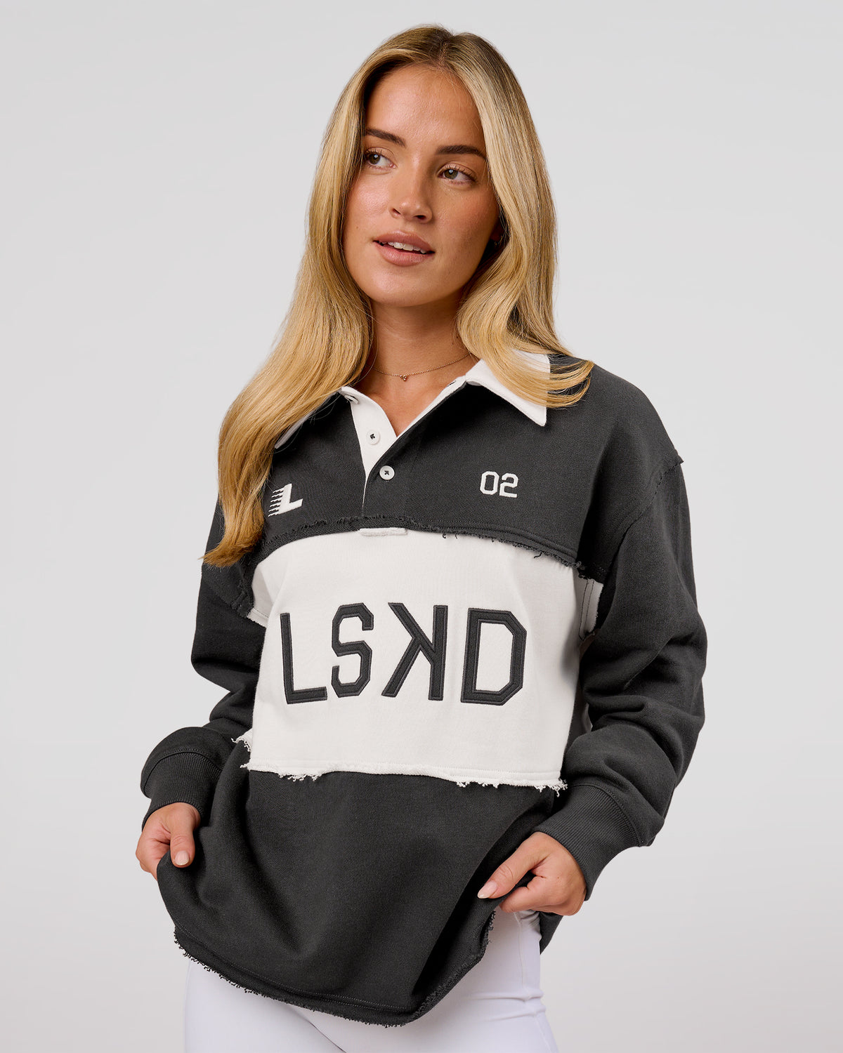 Woman wearing Playbook Unisex Collared Sweater - Onyx-Off White | Model:Issy | Size:XS - view 1