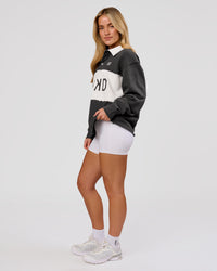 Woman wearing Playbook Unisex Collared Sweater - Onyx-Off White | Model:Issy | Size:XS | Thumbnail Index: 18