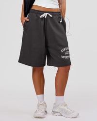 Woman wearing Playbook Varsity Fleece Shorts - Onyx-Off White | Model:Issy | Size:XS | Thumbnail Index: 1