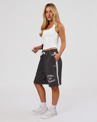 Woman wearing Playbook Varsity Fleece Shorts - Onyx-Off White | Model:Issy | Size:XS | Thumbnail Index: 5
