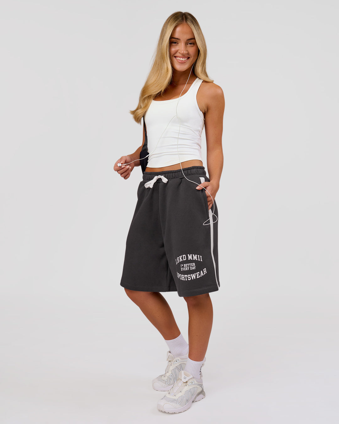 Woman wearing Playbook Varsity Fleece Shorts - Onyx-Off White | Model:Issy | Size:XS - view 8