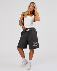 Woman wearing Playbook Varsity Fleece Shorts - Onyx-Off White | Model:Issy | Size:XS | Thumbnail Index: 11