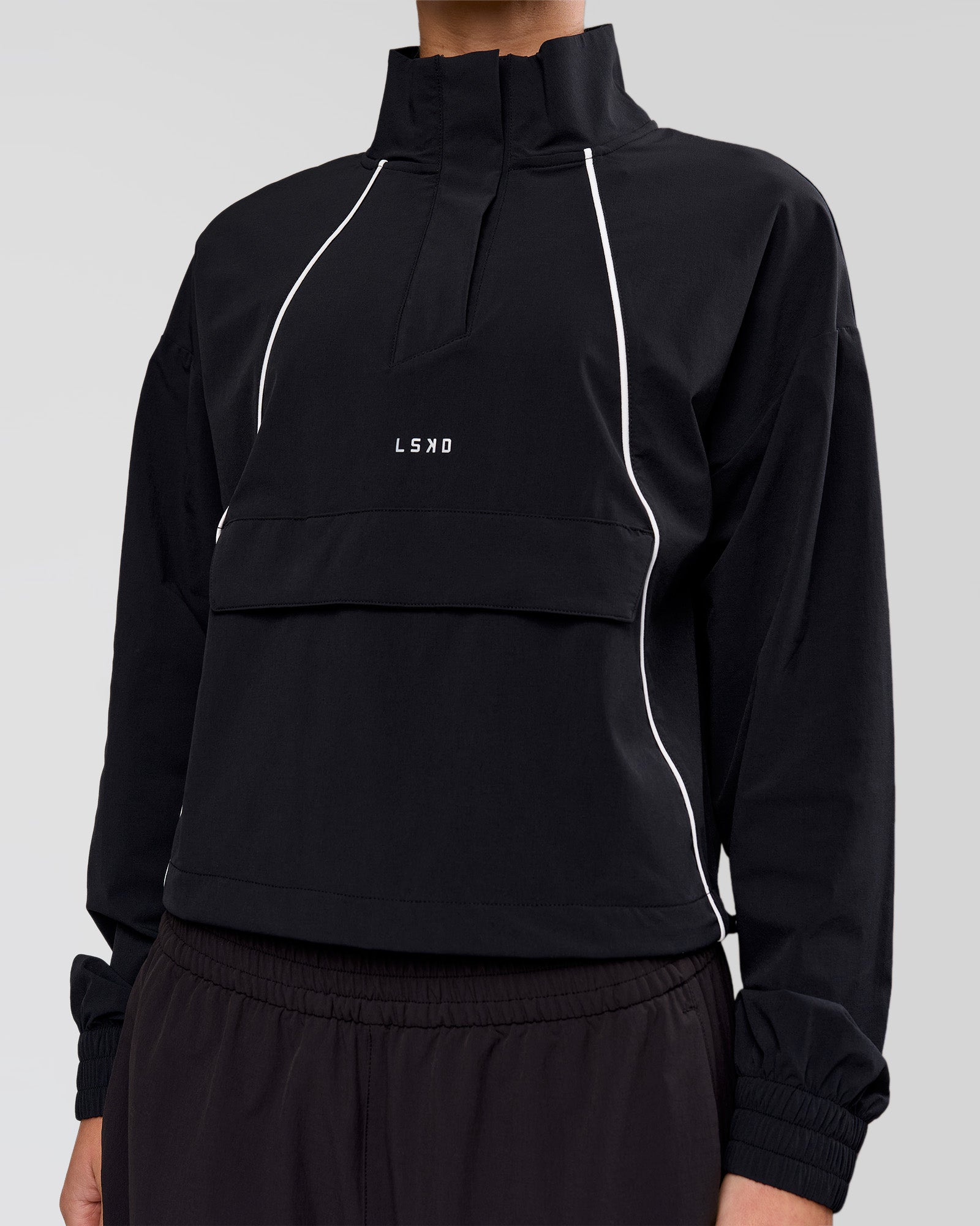 Woman wearing Pop Over Jacket - Black | Model:Issy | Size:XS