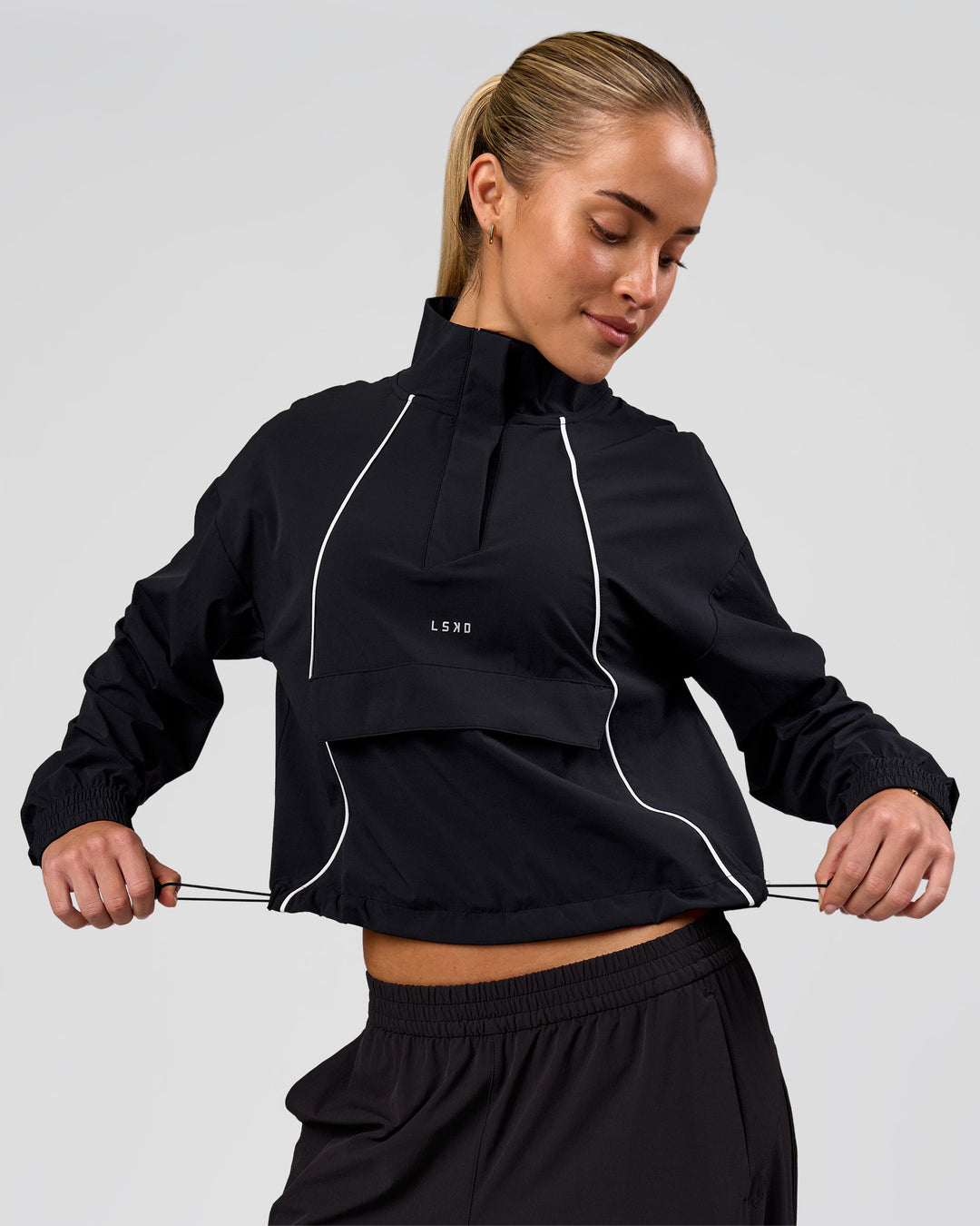 Woman wearing Pop Over Jacket - Black | Model:Issy | Size:XS - view 1
