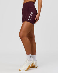 Woman wearing Rep Ultra High-Rise 4" Short Pockets - Cherry Lacquer-White | Model:Issy | Size:XS | Thumbnail Index: 3