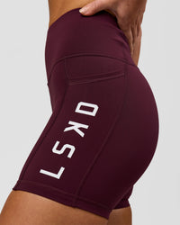 Woman wearing Rep Ultra High-Rise 4" Short Pockets - Cherry Lacquer-White | Model:Issy | Size:XS | Thumbnail Index: 4